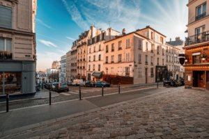 travel Streets of the Montmartre Quarter in Paris, France. Morning light with blue sky.