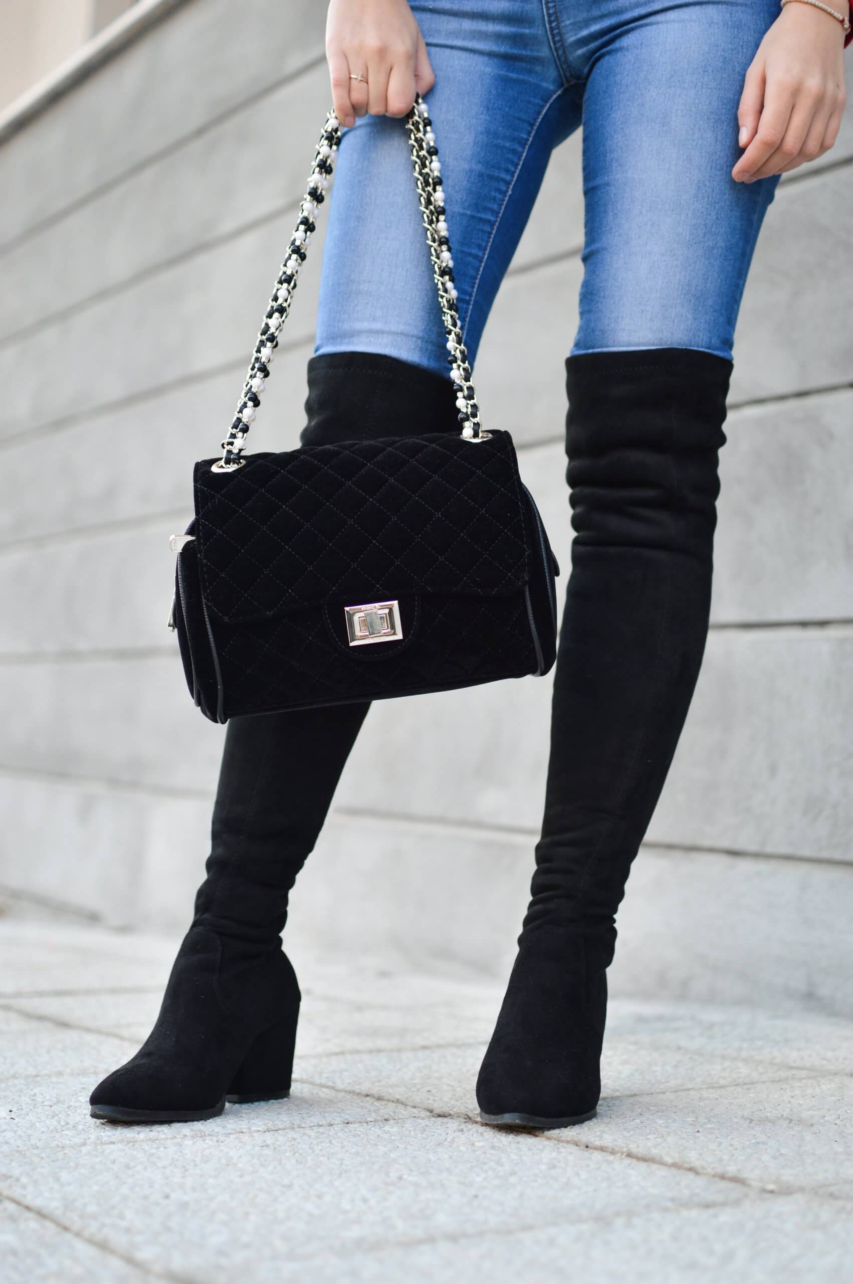 Tall boots and a black bag. 