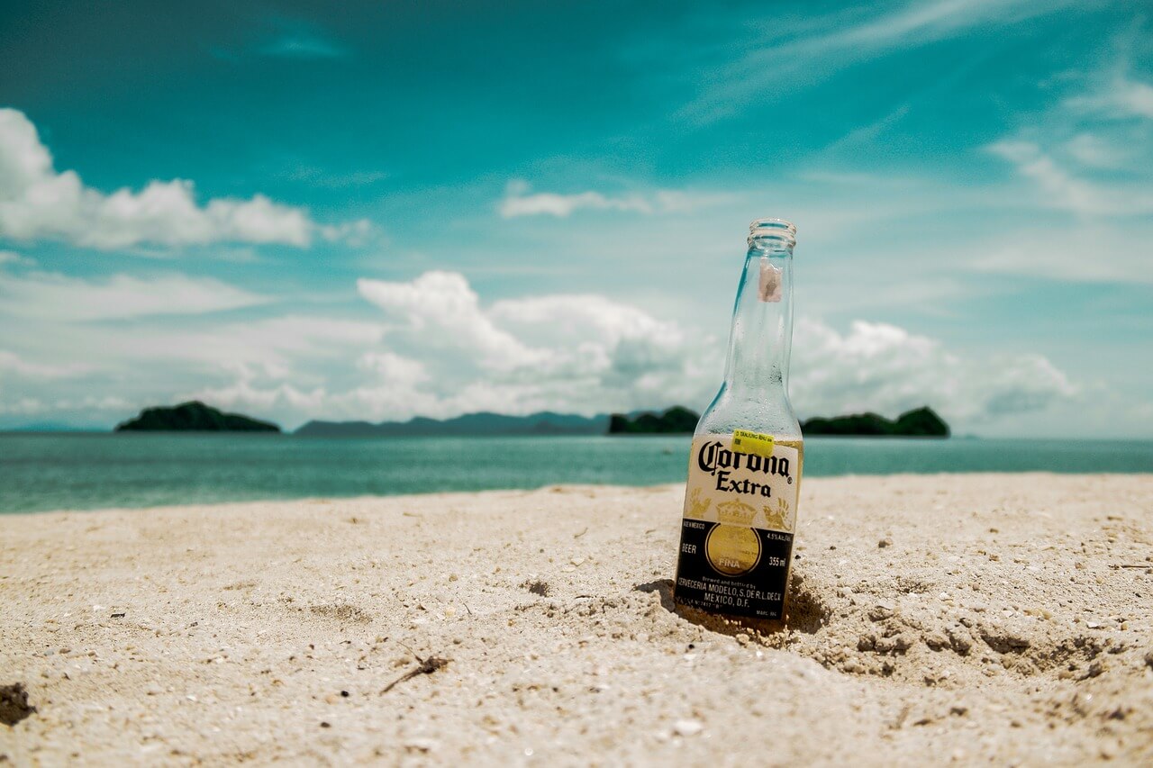 Corona Bottle in sand